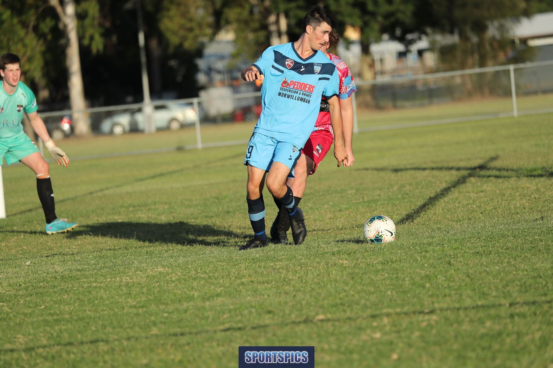 tweed united footballer looking to pass the ball