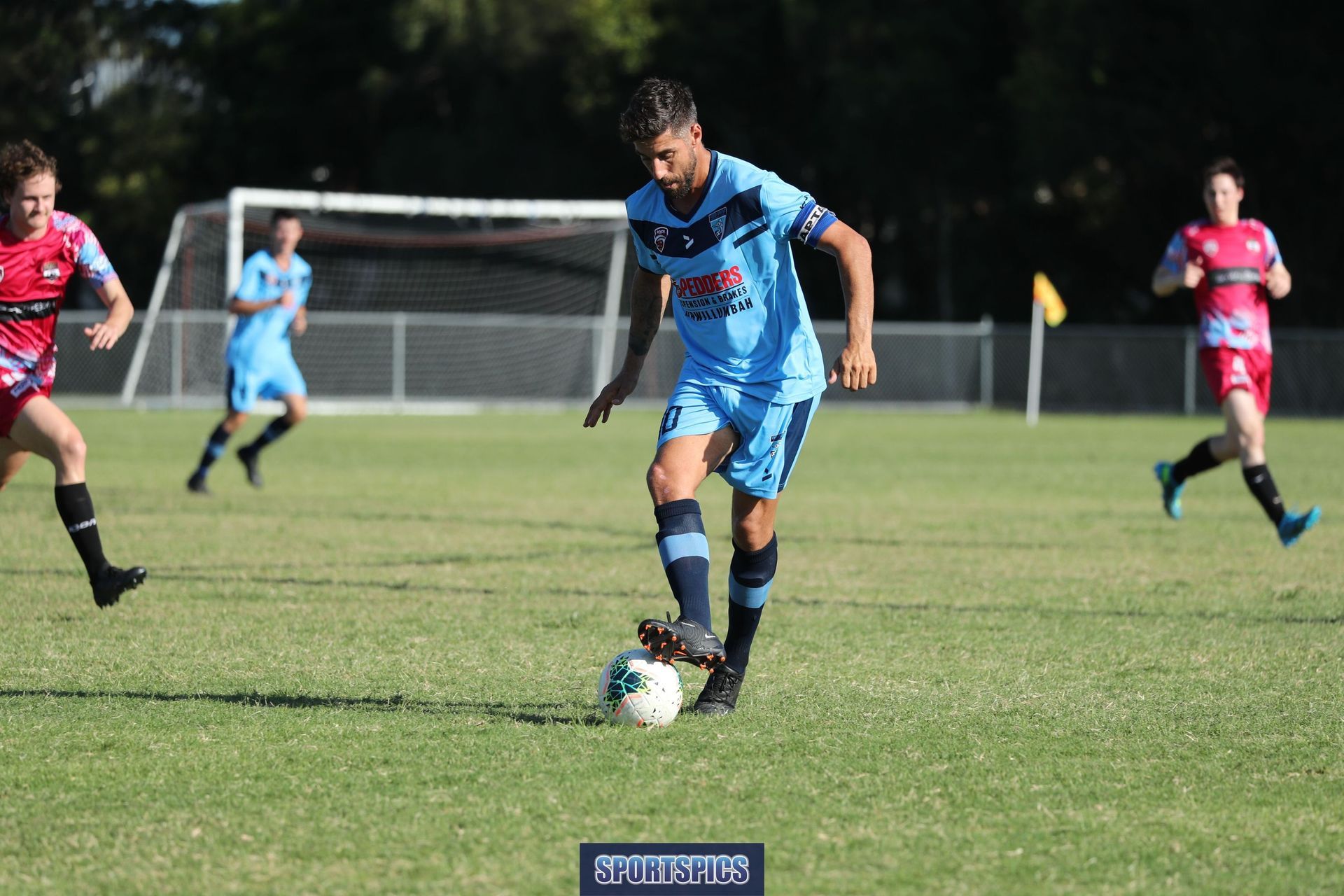 tweed united footballer trapping the ball
