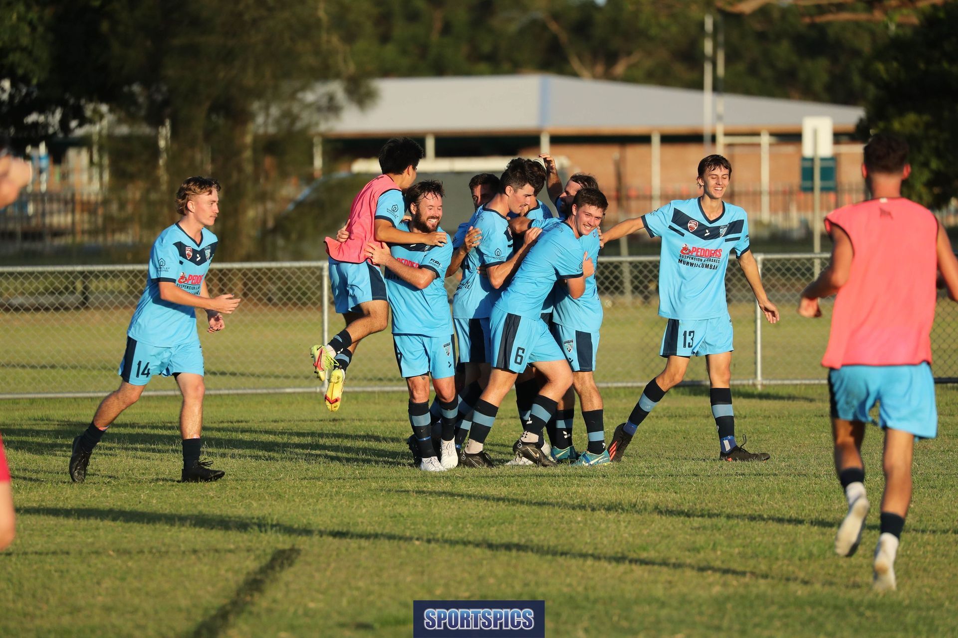 tweed united footballers celebrating a goal