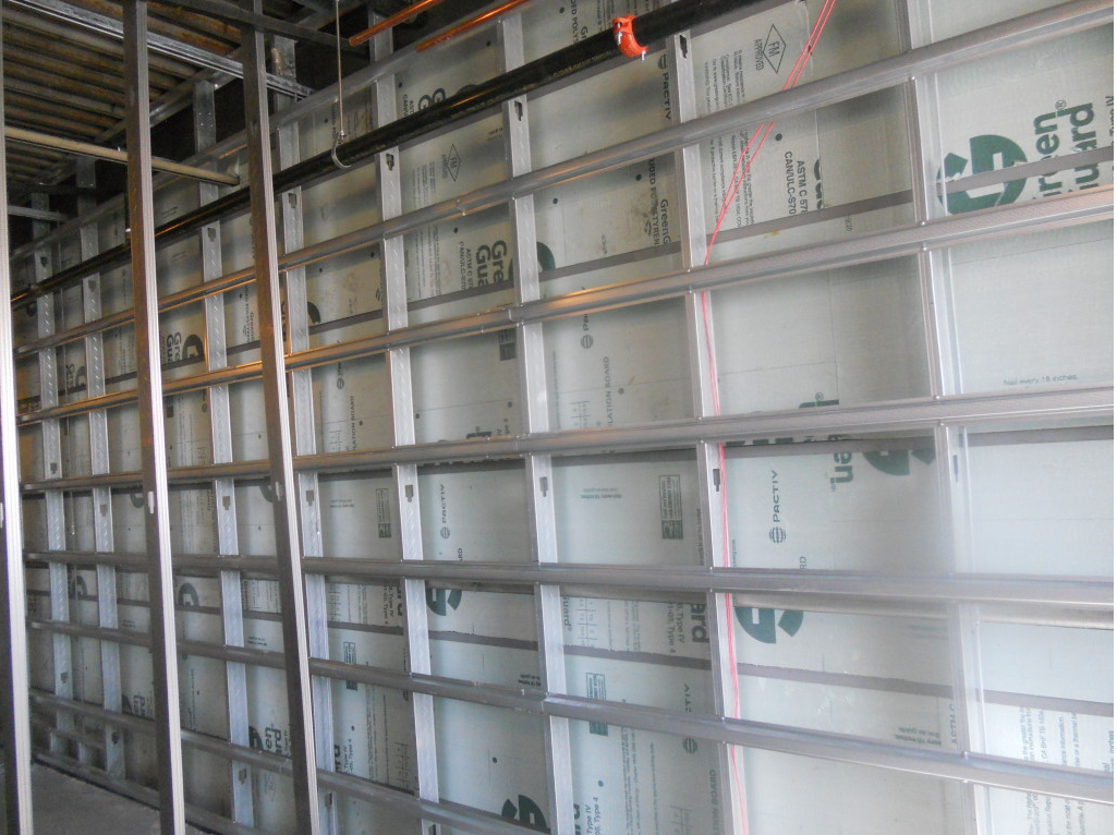 Industrial shelving with stacked white boxes in a warehouse aisle