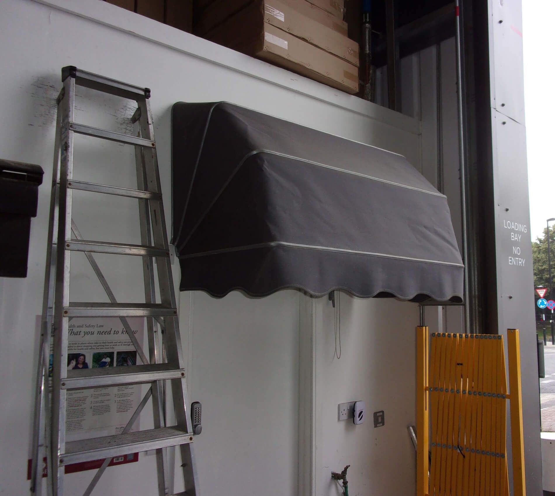 Professional awning sign installation by Carolina Signs and Wonders in Raleigh