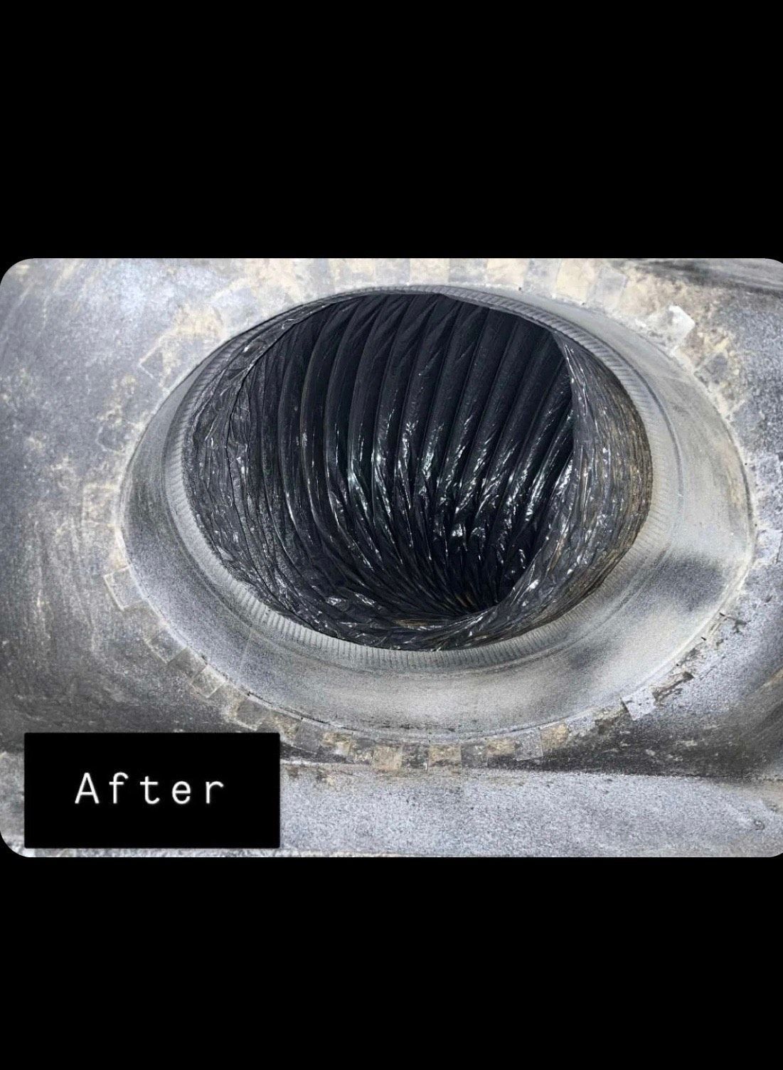 Close-up of a circular, textured black opening in a grey, industrial surface, labeled 