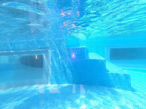 Certified Swimming Pool inspector in Florida performing a high end underwater swimming  pool inspection