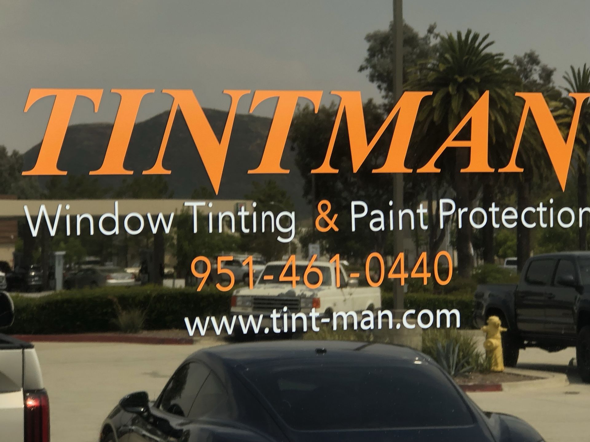 A sign for tintman window tinting and paint protection