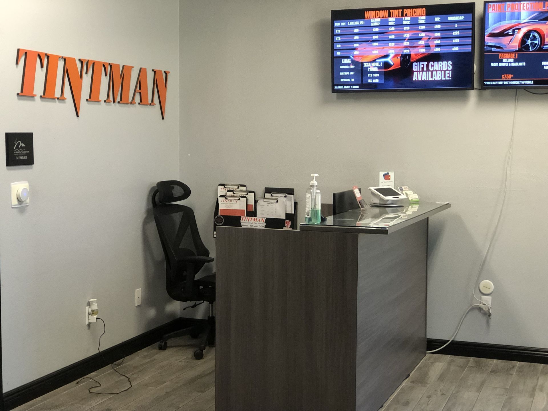 The word tintman is on the wall above the desk