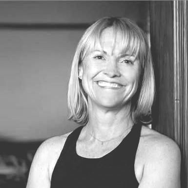 Dean Curtain is smiling in a black and white photo .