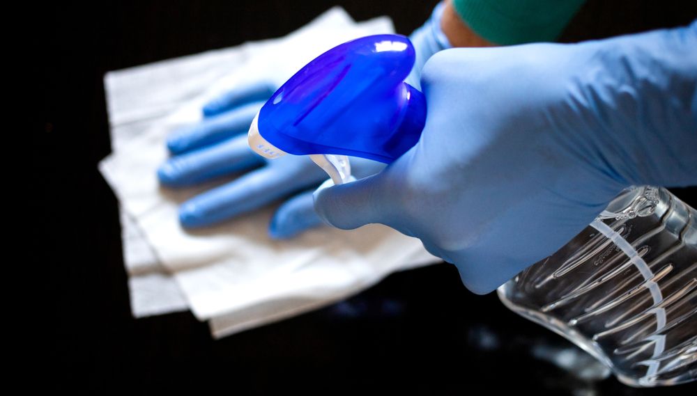 Person Cleaning The Table