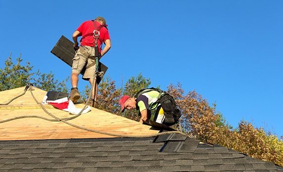 Workers replace roof
