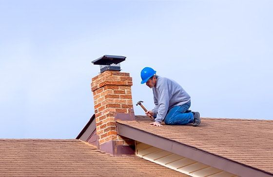 Worker repairs roof