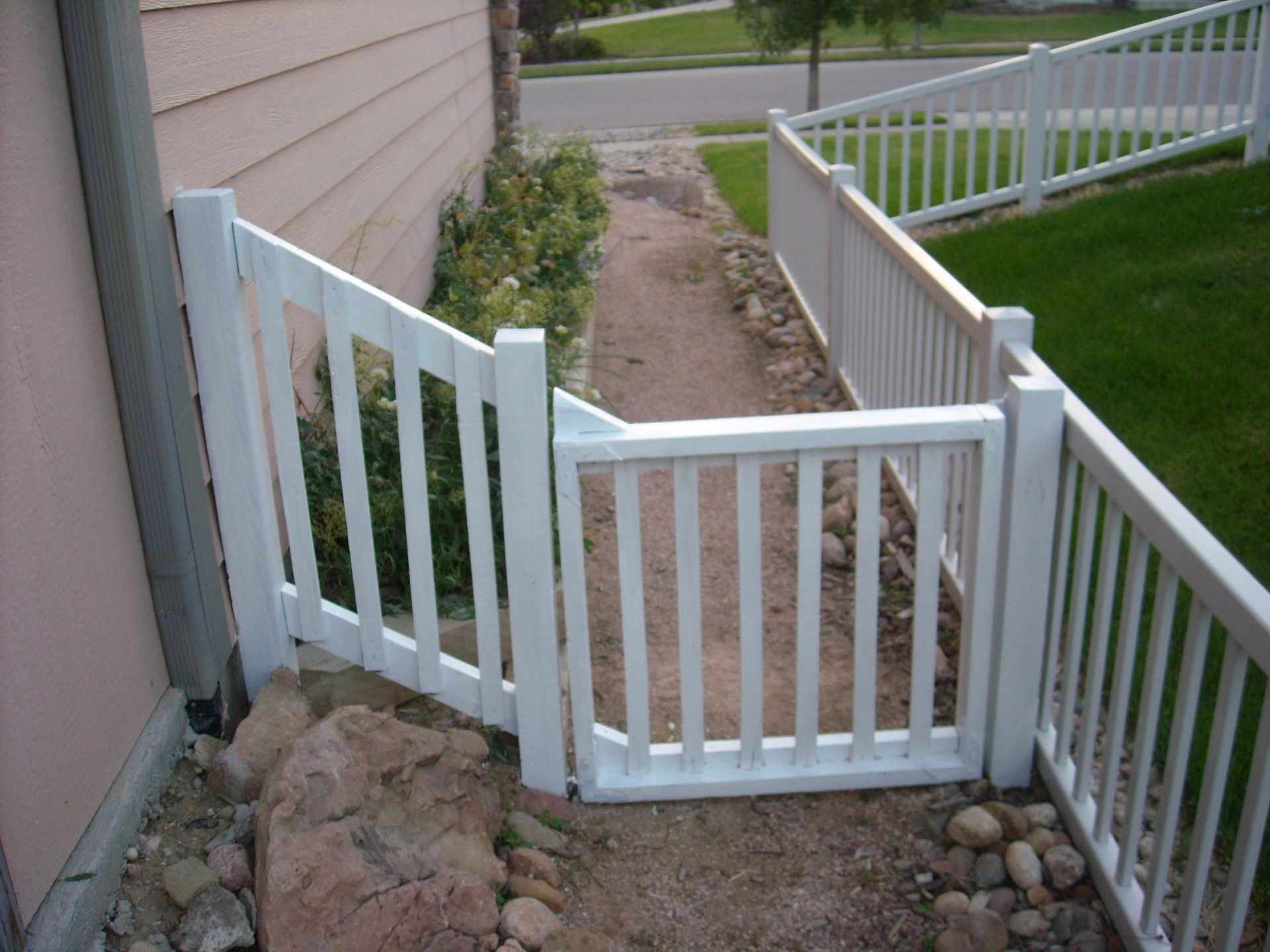 Small gate to extend the vinyl fencing on the side