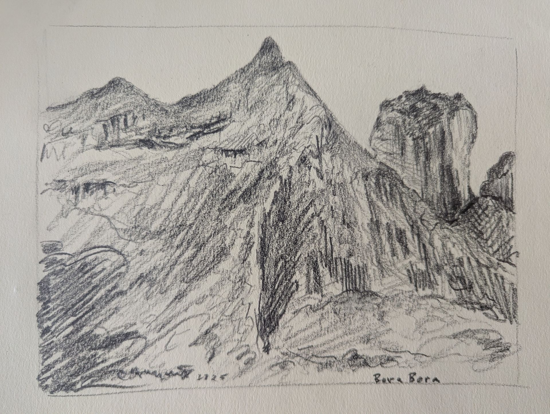 Two people paddle a wooden boat on a body of water.