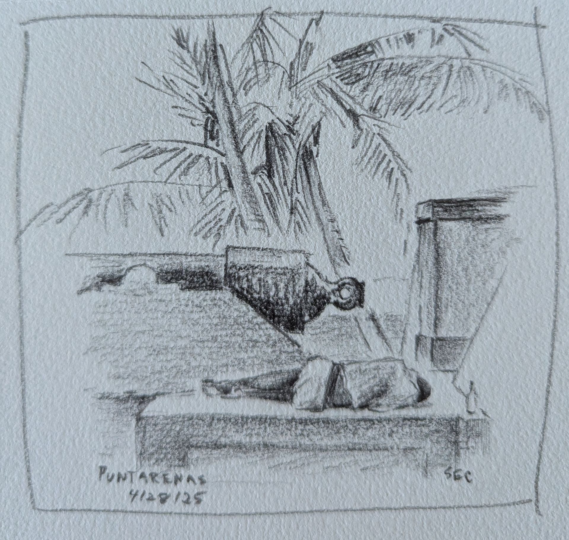 A black and white drawing of a man laying on the ground