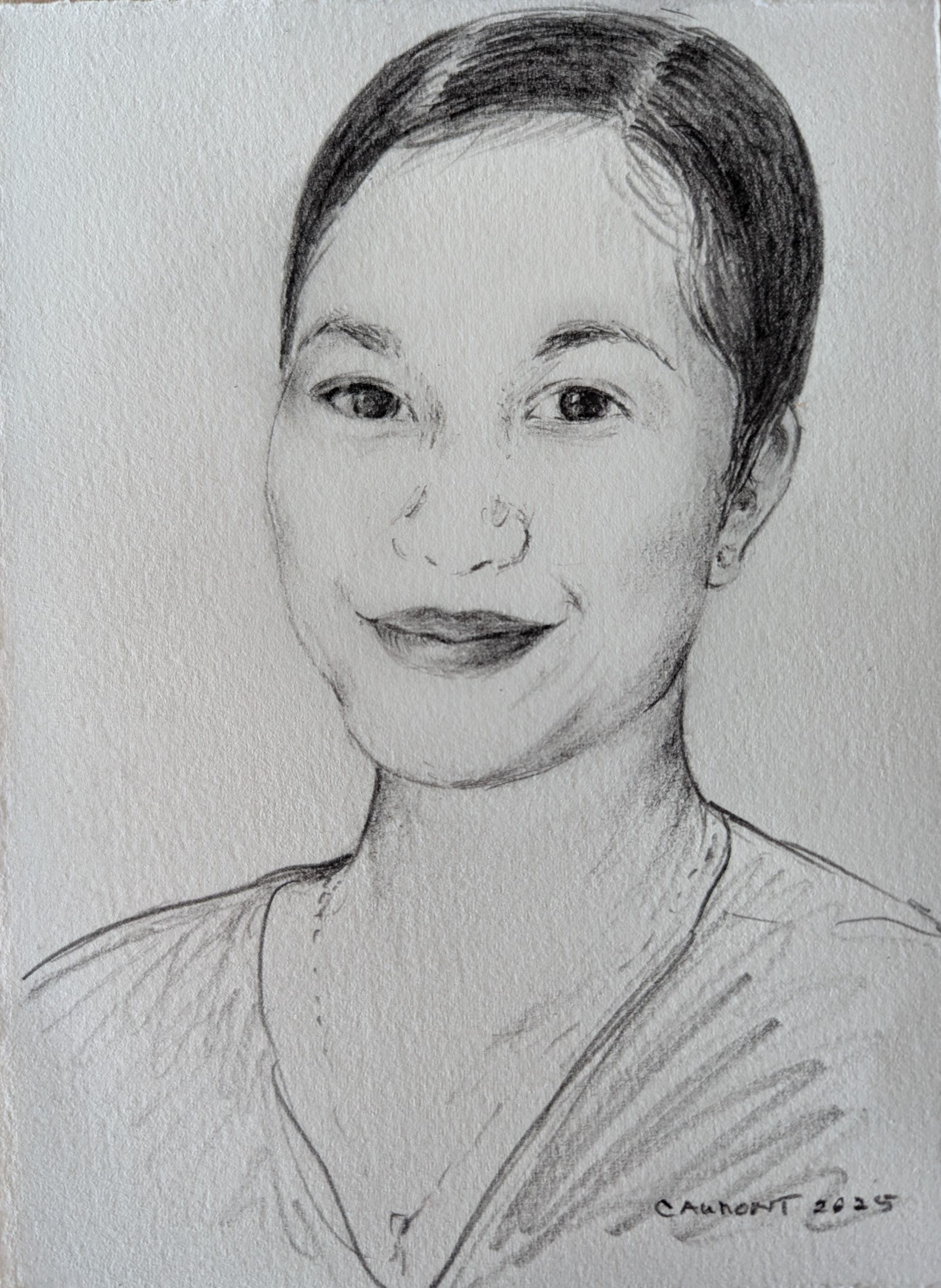 Pencil portrait of a woman with short dark hair, smiling. She wears a light-colored top.