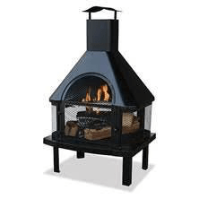 A black fireplace with a chimney on top of it.