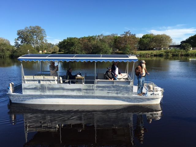 A boat is floating on top of a body of water.