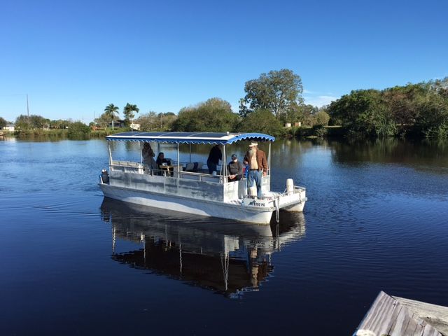 A boat is floating on top of a body of water.