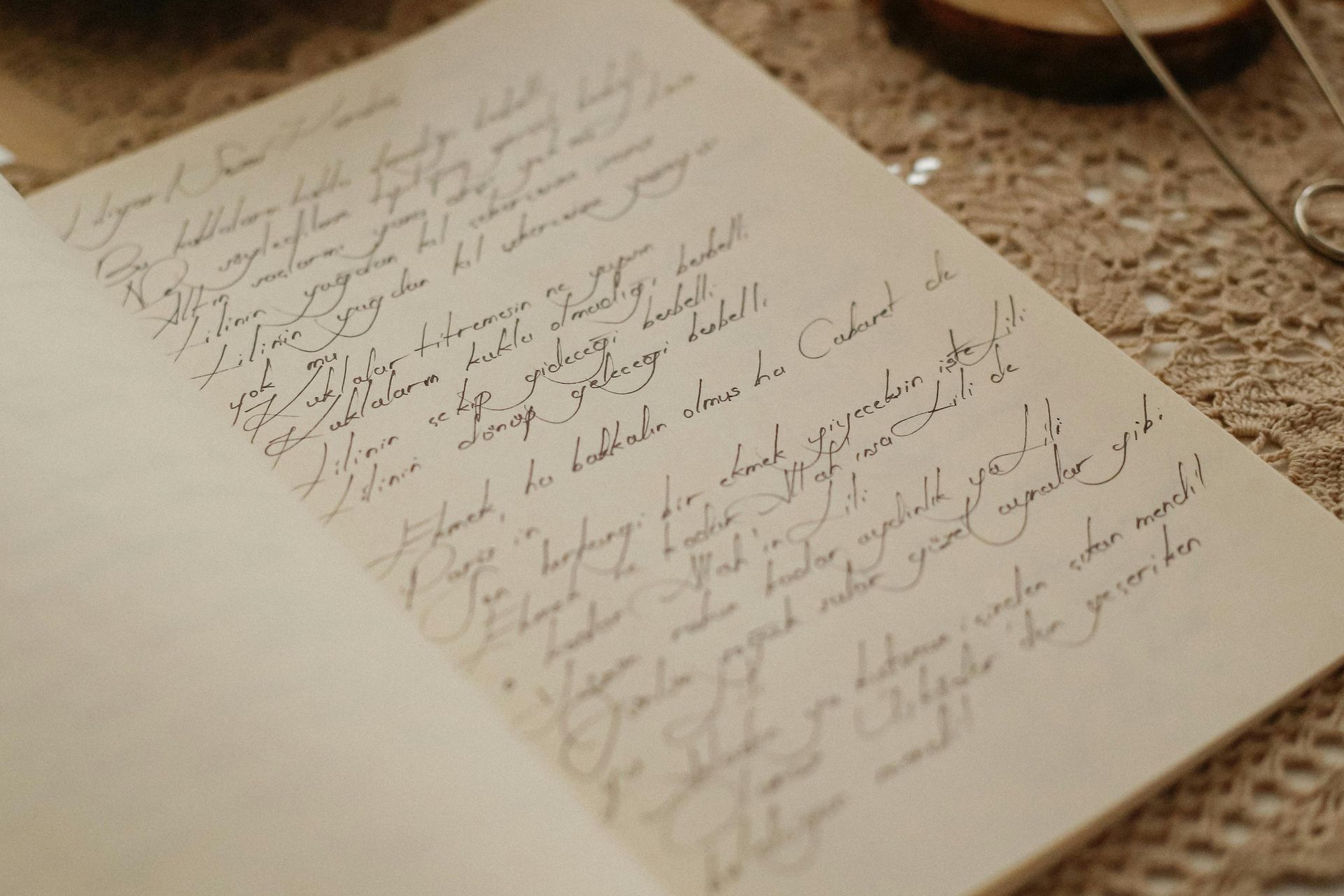 A piece of paper with handwriting on it is sitting on a table.