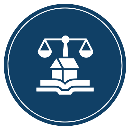 Scales of justice over a house, on an open book, within a blue circle.
