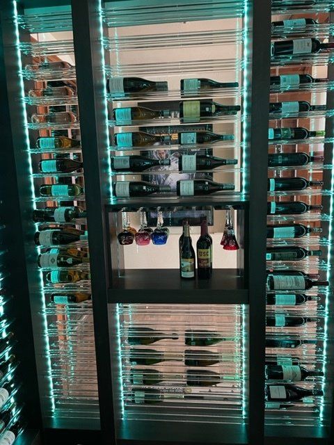 A wine cellar filled with lots of bottles of wine