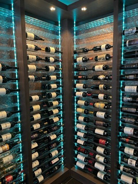 A wine cellar filled with lots of bottles of wine