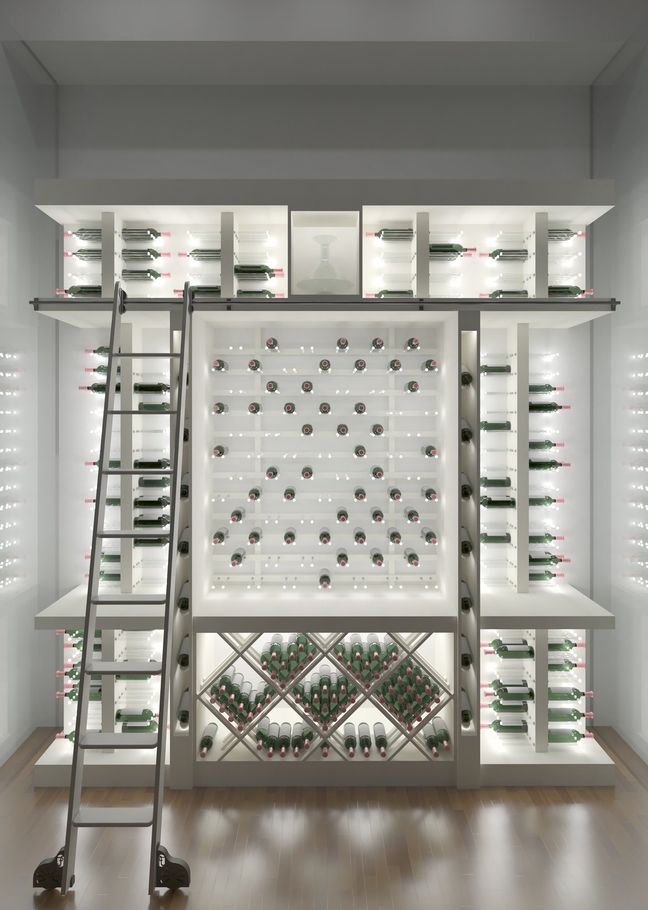 A wine cellar with a ladder and shelves filled with bottles of wine.