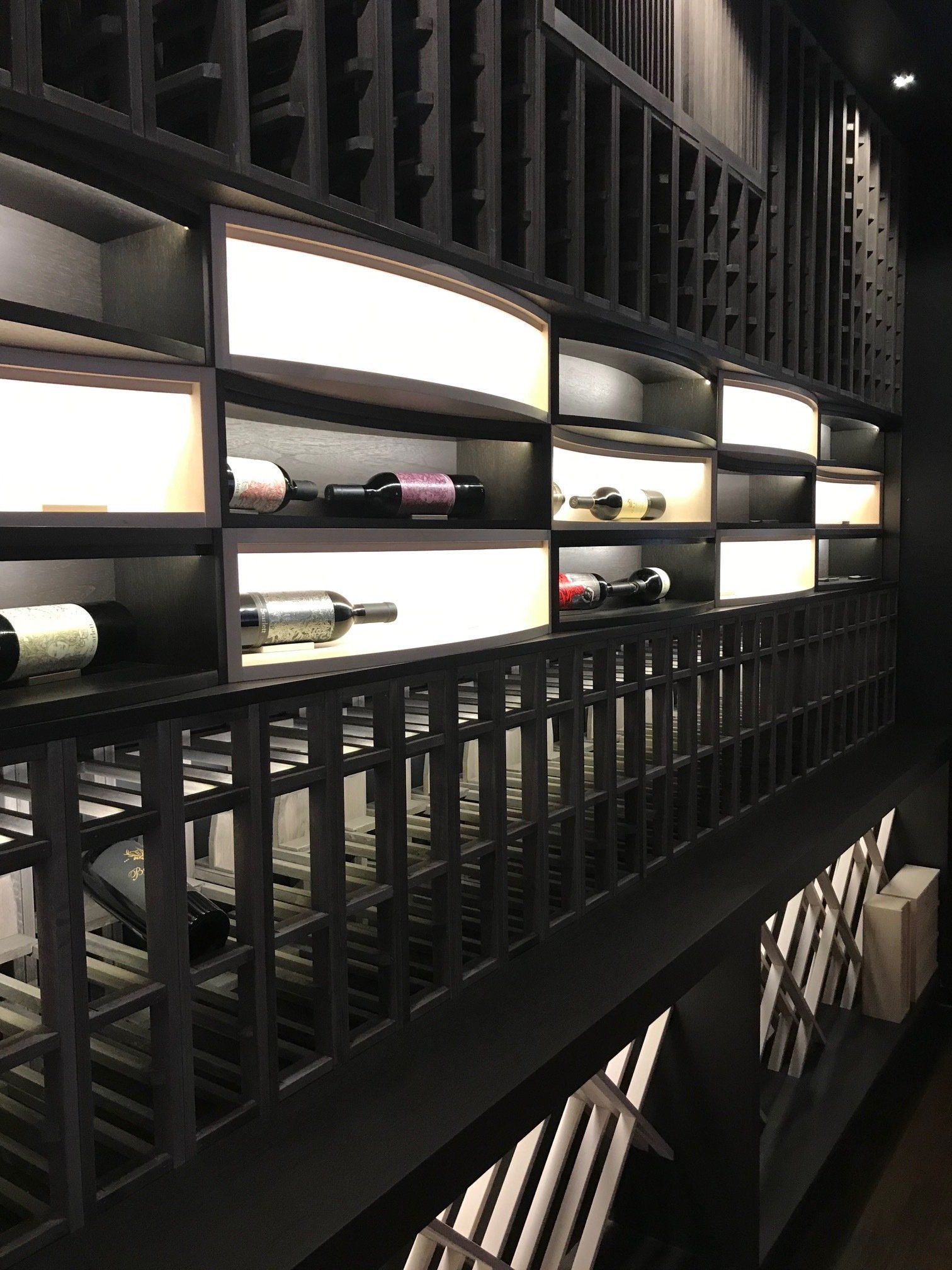 A wine cellar filled with lots of bottles of wine