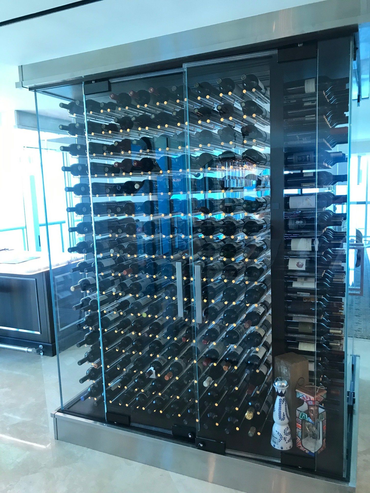 A large wine cellar filled with lots of bottles of wine.