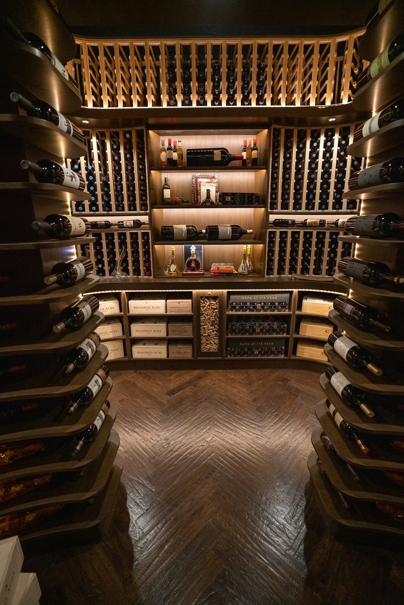 A large wine cellar filled with lots of bottles of wine.