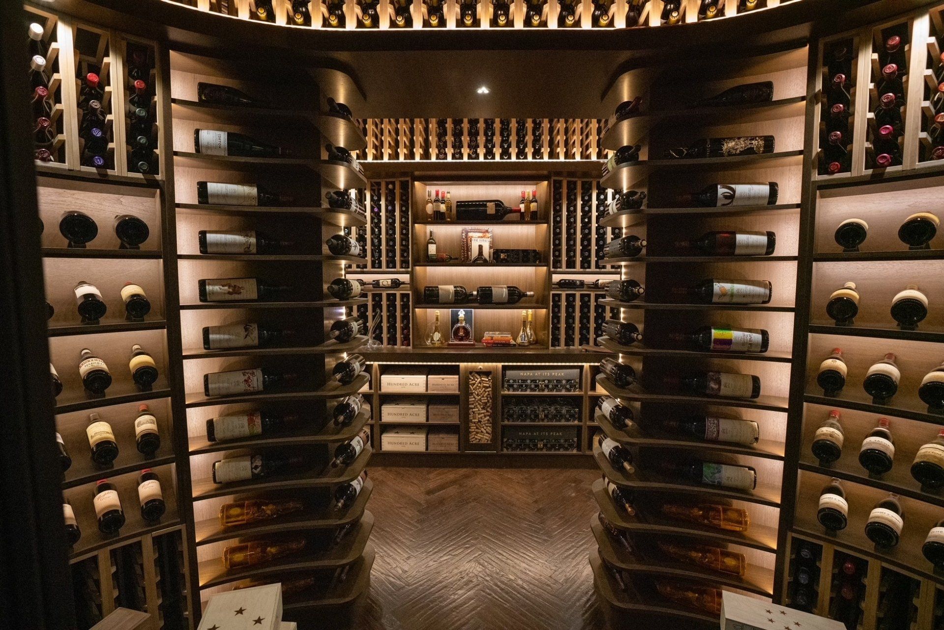 A large wine cellar filled with lots of bottles of wine.