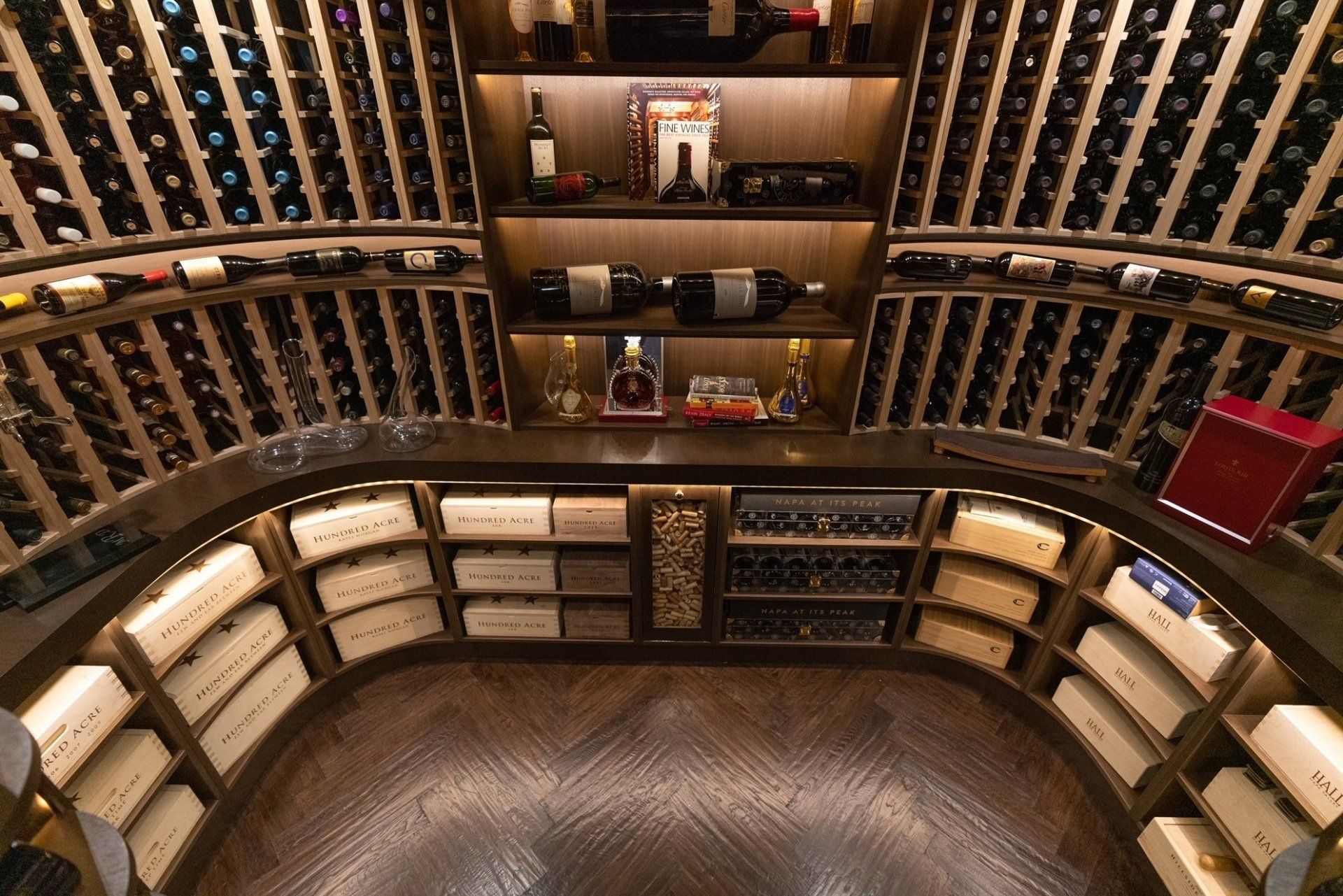 A large wine cellar filled with lots of wine bottles