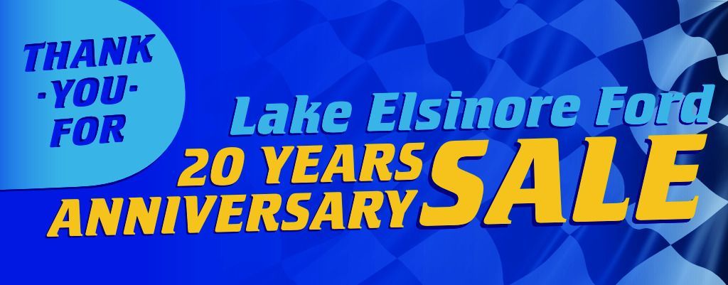 Blue banner for Lake Elsinore Ford, 20 Years Anniversary Sale; words in yellow and blue, checkered background.