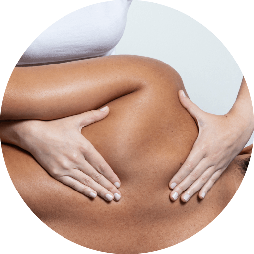 A woman is giving a man a massage on his back