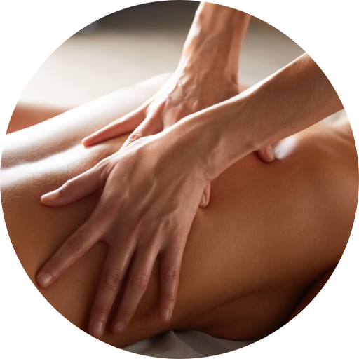A woman is getting a massage with her hands on her back