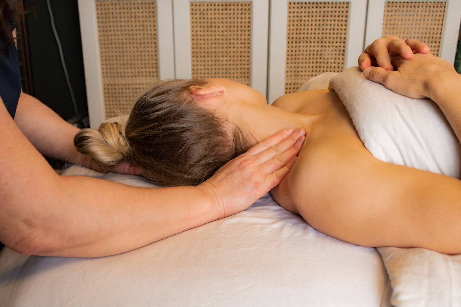 A woman is getting a massage at a spa.