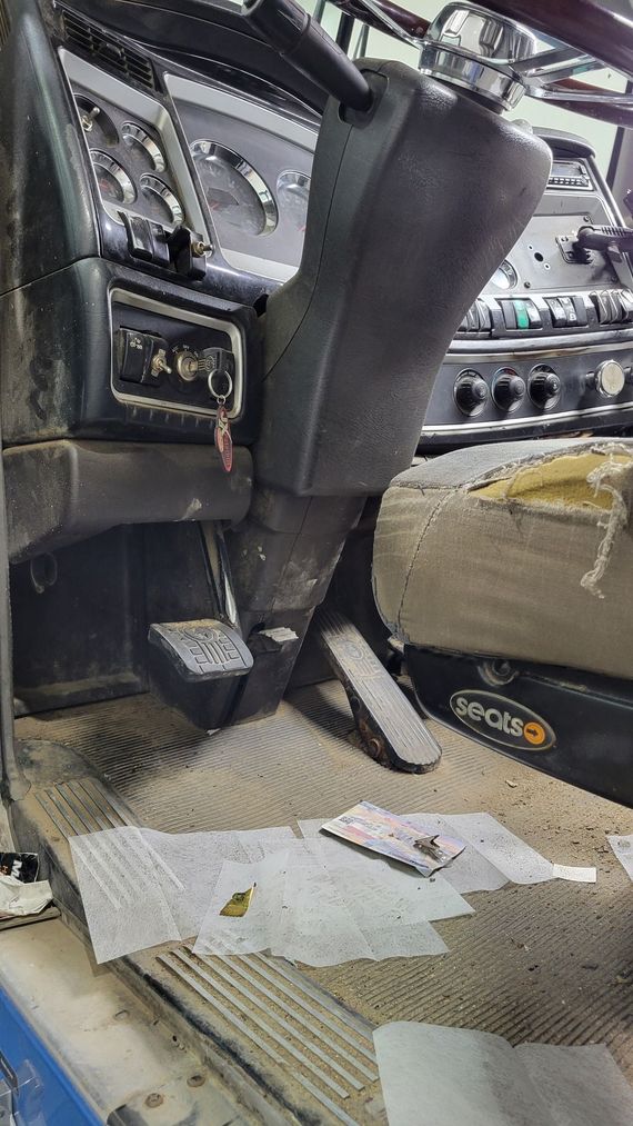 A close up of a dirty dashboard in a car.