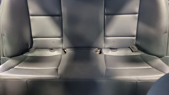 A close up of the back seat of a car.