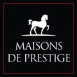 Un logo pour maisons de prestige avec un cheval blanc sur fond noir.