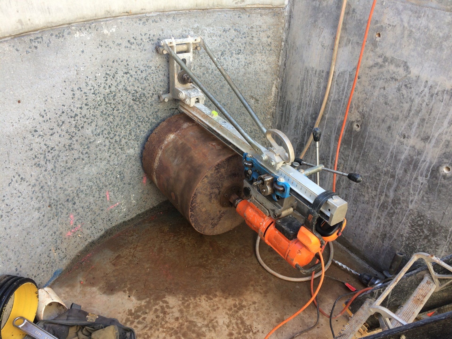 Worker Using Machine To Cut The Asphalt Road — Concrete Cutters In Taree, NSW
