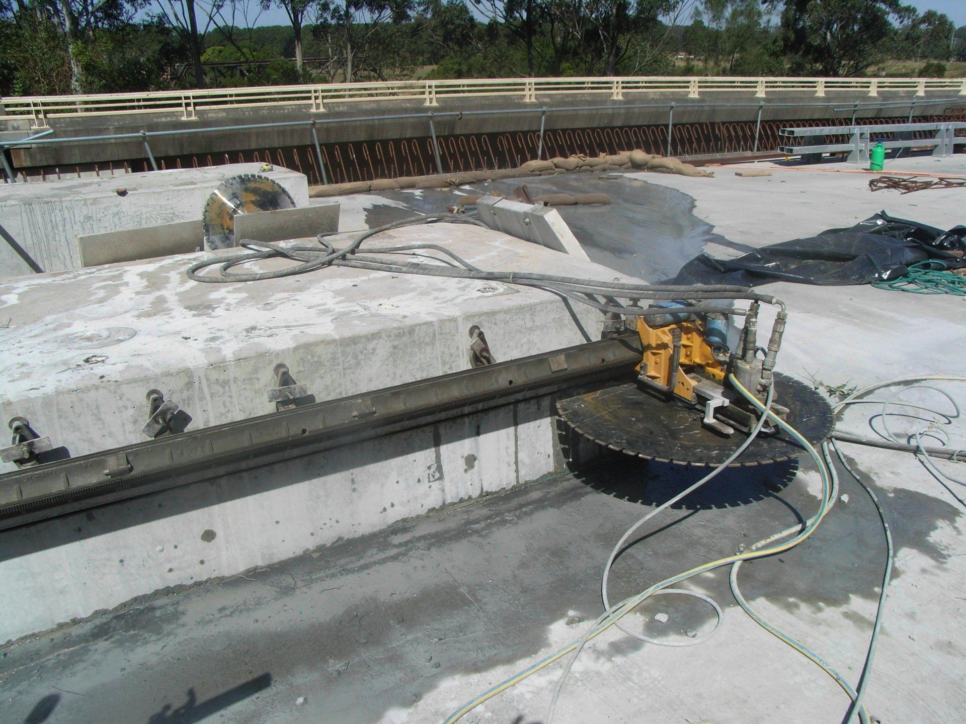 Construction Worker Cuts A Concrete Wall — Concrete Cutters In Port Macquarie, NSW