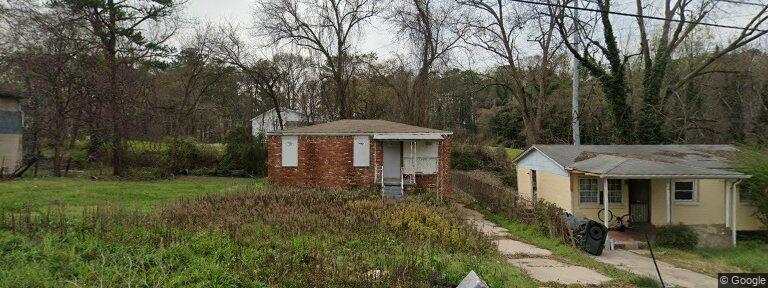 Small brick house with white window — Tucker, GA — G&R Construction