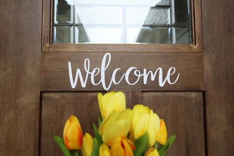 Front Door with Flowers and Welcome Sign