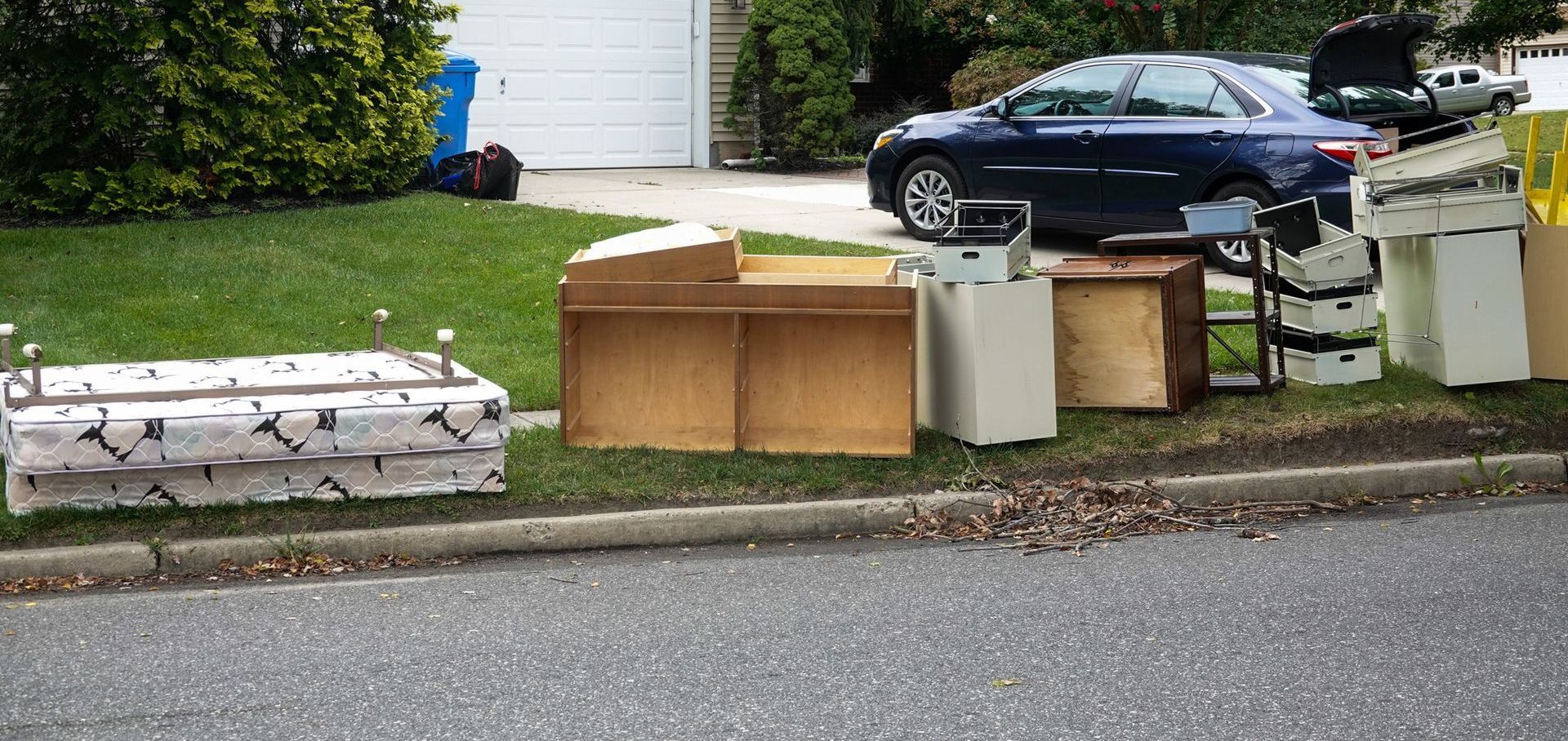 A storage unit filled with lots of boxes and furniture.