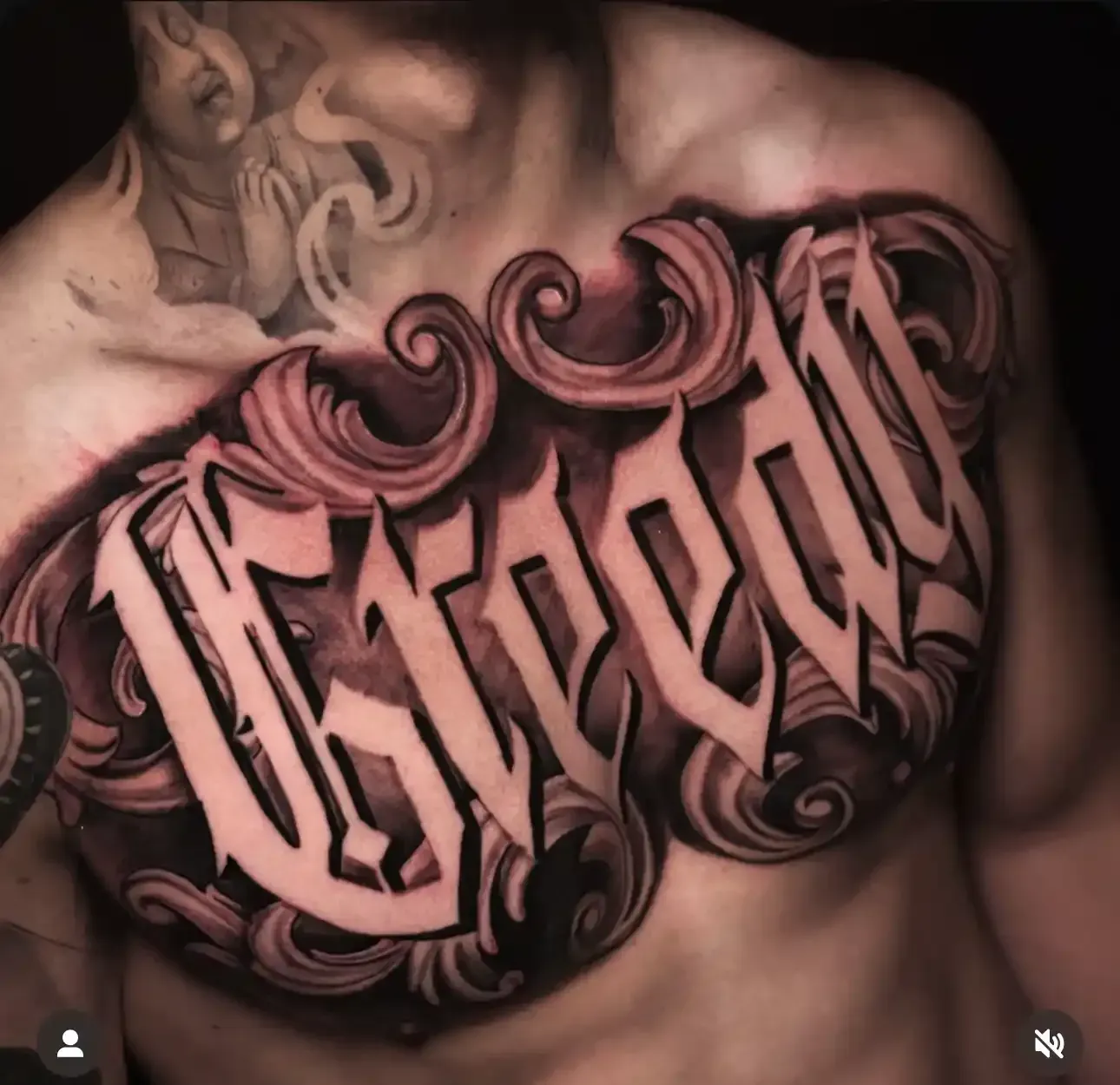 Image of a chest tattoo with lettering by Igor