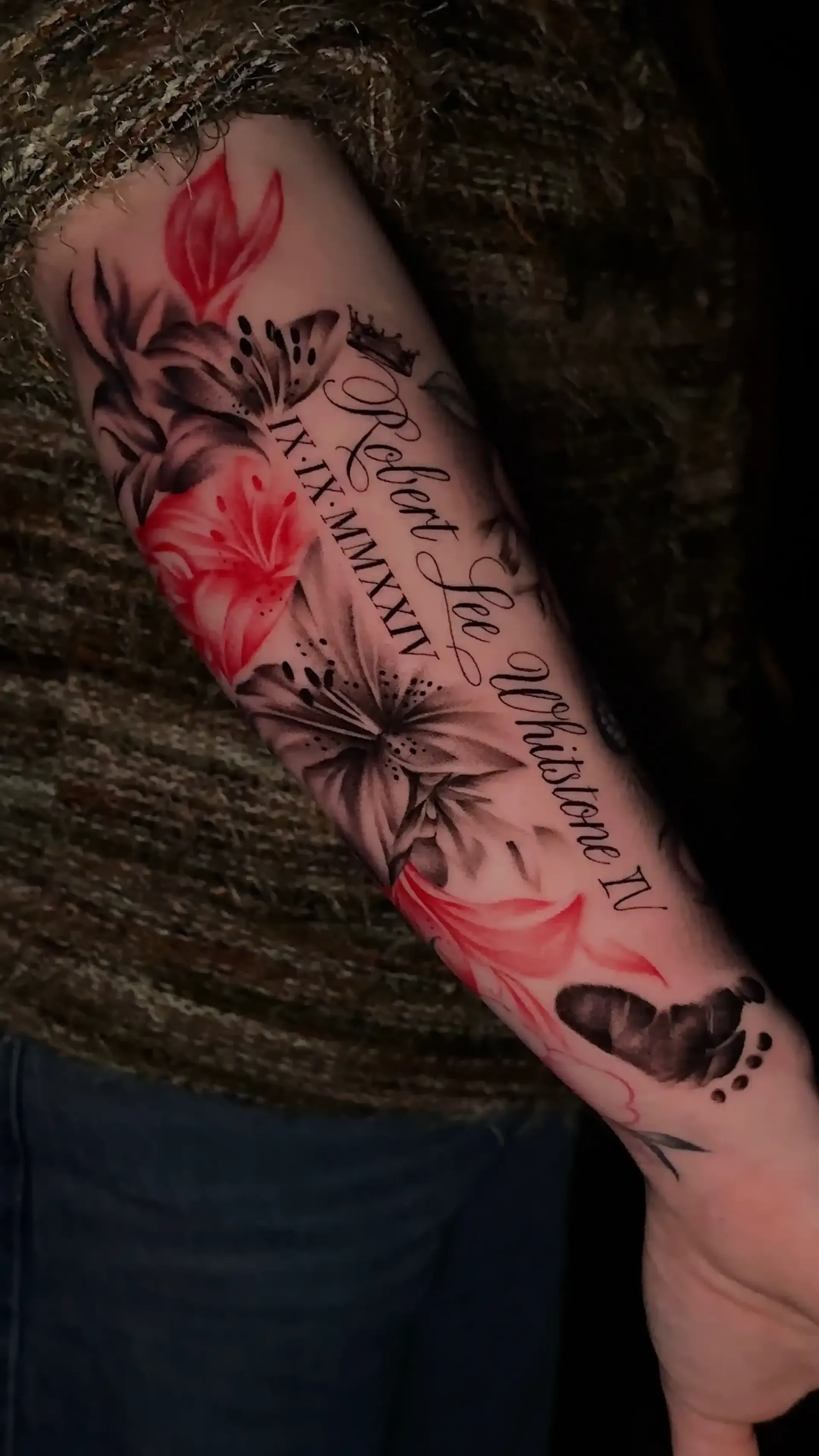 Black and red floral tattoo with script lettering by Savana Rodriguez at Black Rhino Tattoos in Las Vegas
