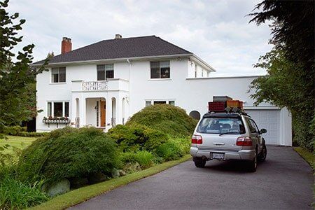 Traditional American Home with driveway — Residential Asphalt Coating in Burlington, VT