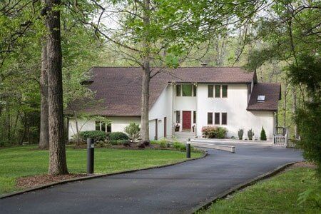 Modern Home with driveway — Residential Asphalt Coating in Burlington, VT