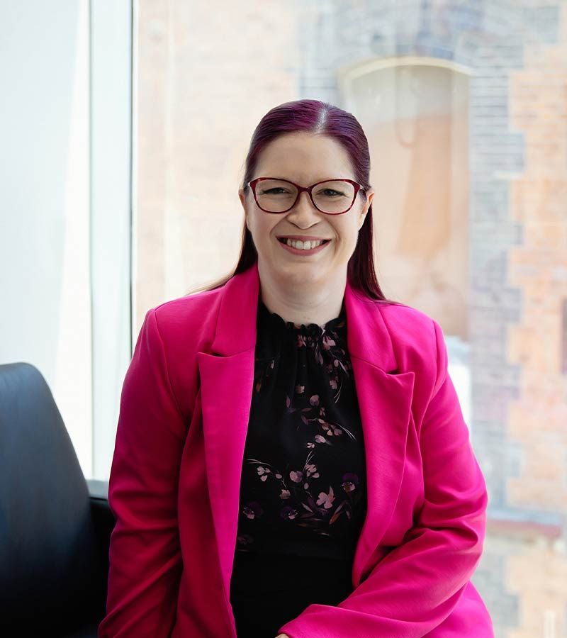 People looking over financial documents | Featured image for the SME Accounting Services page of Rudd Mantell Accountants.