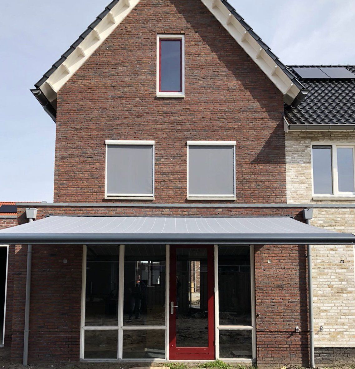 Knikarmscherm, windvaste ritsscreens