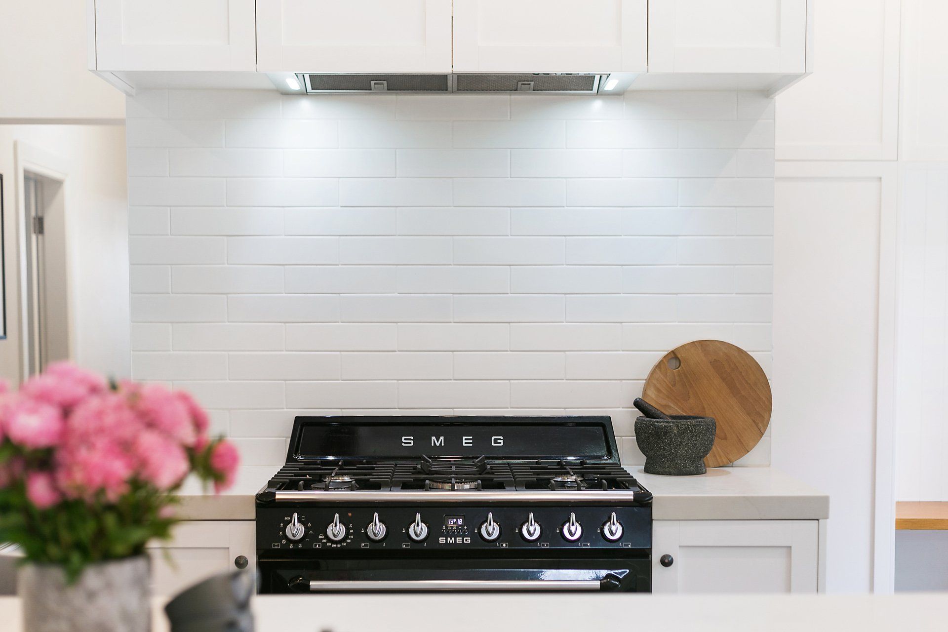 Ann Street project kitchen stove with beautiful white splashback