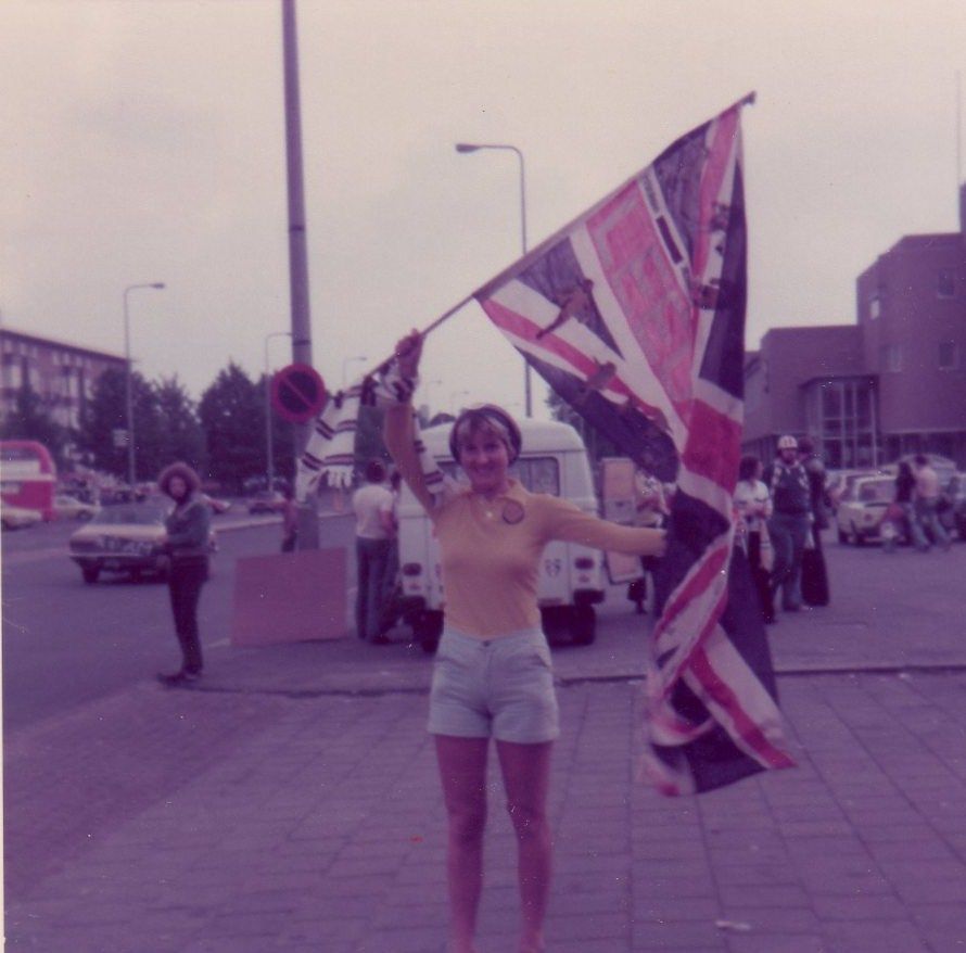 Heidi Haigh during pre-season tour in Amsterdam 1976  holding her Leeds Union Jack flag